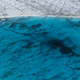 A lake of meltwater forms on the Greenland ice sheet near Sermeq Avangnardleq Glacier.